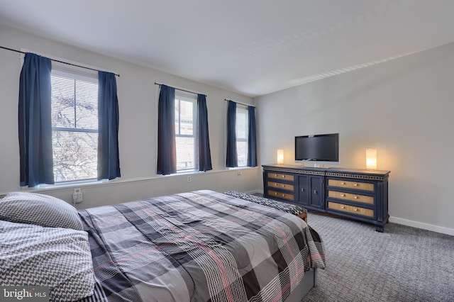 bedroom with carpet and baseboards