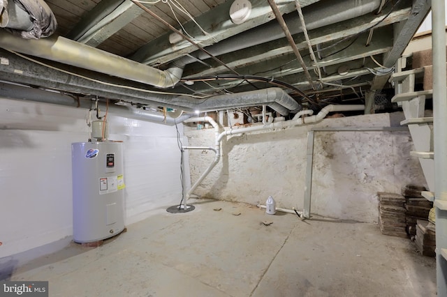 unfinished basement with electric water heater