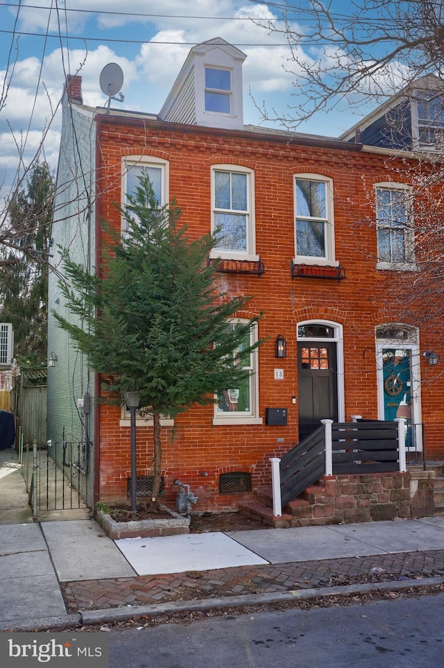 view of front of house featuring brick siding