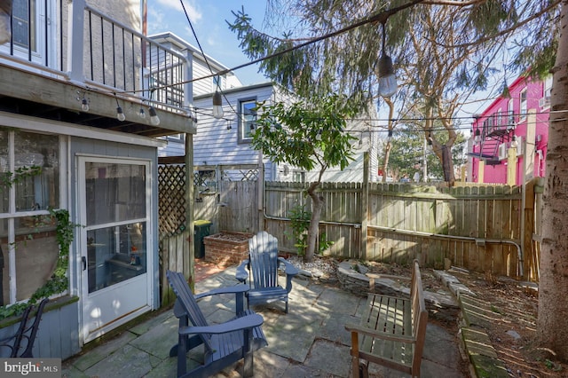 view of patio / terrace featuring fence