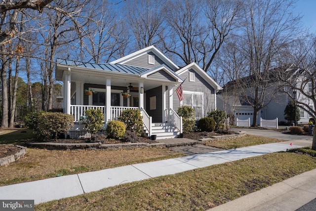 bungalow-style house with a porch and a garage