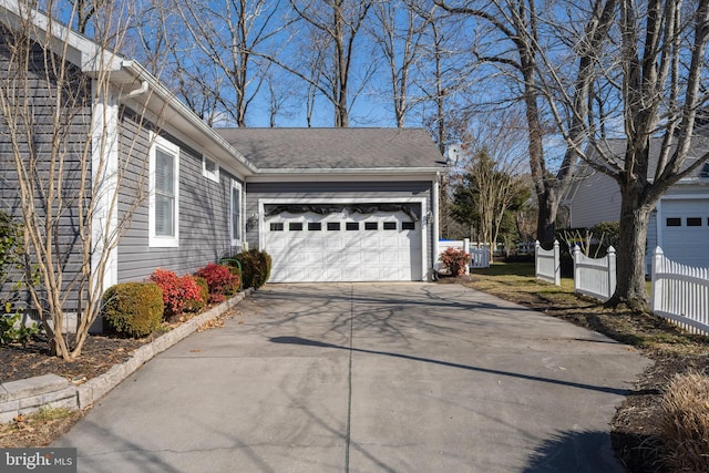 view of side of property with a garage