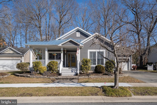 view of front facade with a porch and a garage