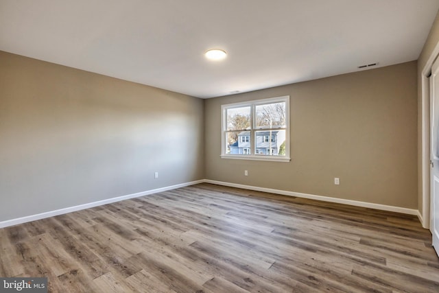 unfurnished bedroom featuring light wood-type flooring