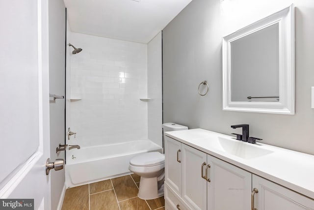 full bathroom with vanity, toilet, and tiled shower / bath combo