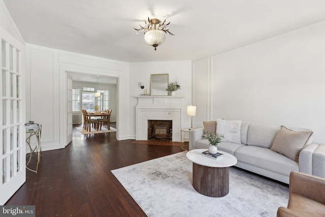 living room with dark hardwood / wood-style floors