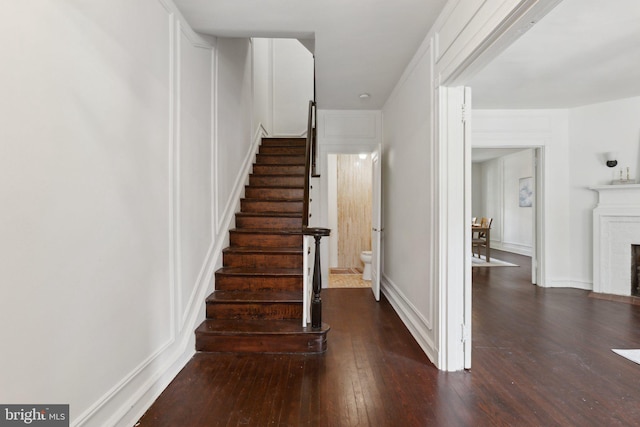 stairway featuring hardwood / wood-style flooring