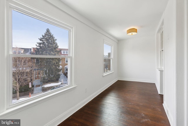 corridor with dark hardwood / wood-style floors