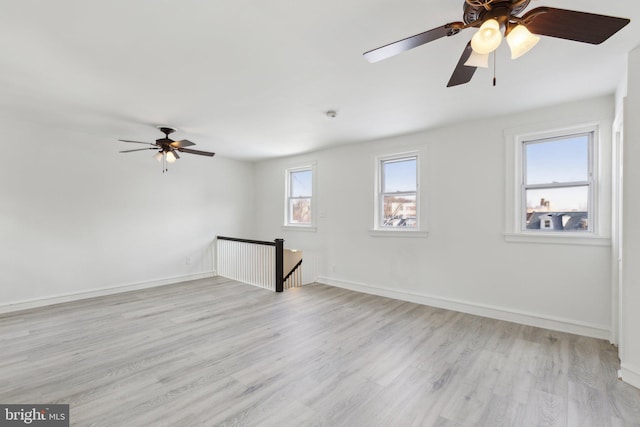 spare room with light hardwood / wood-style flooring