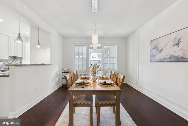 dining room with dark wood-type flooring