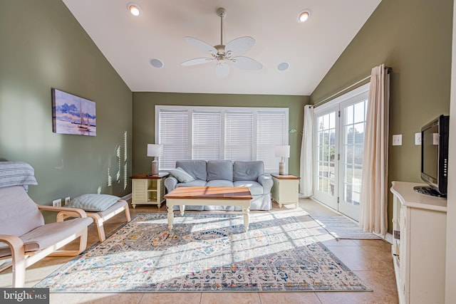 living room featuring ceiling fan, high vaulted ceiling, and light tile patterned floors