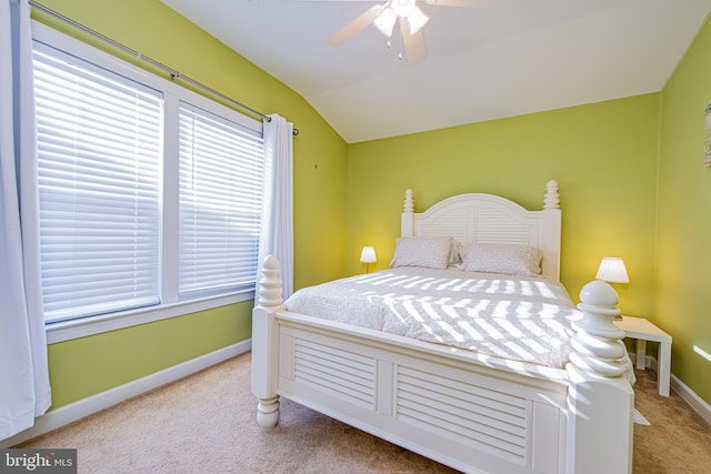 bedroom with lofted ceiling, light colored carpet, and ceiling fan