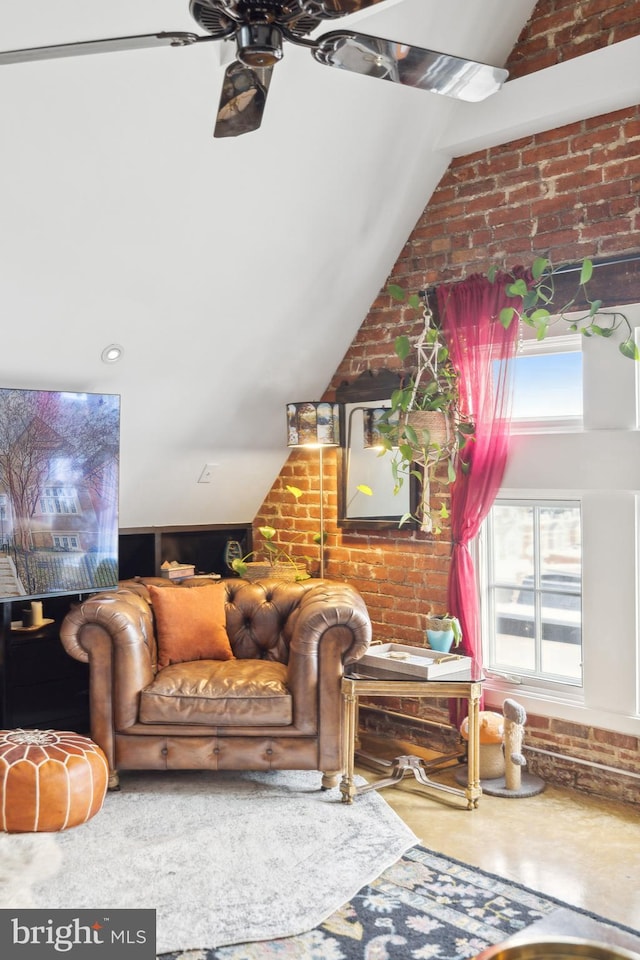 living room with brick wall and vaulted ceiling