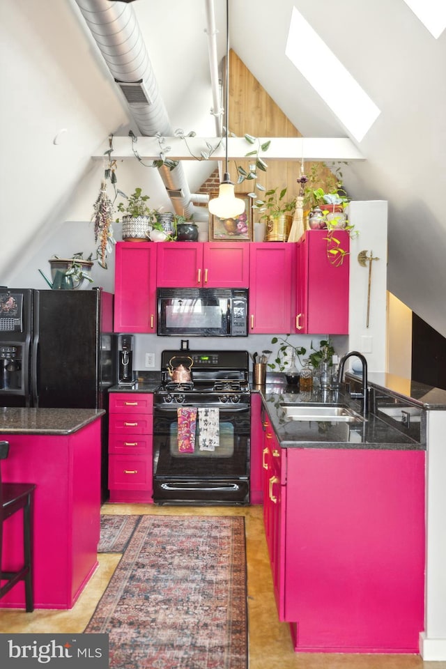 kitchen featuring sink, a skylight, a center island, black appliances, and kitchen peninsula