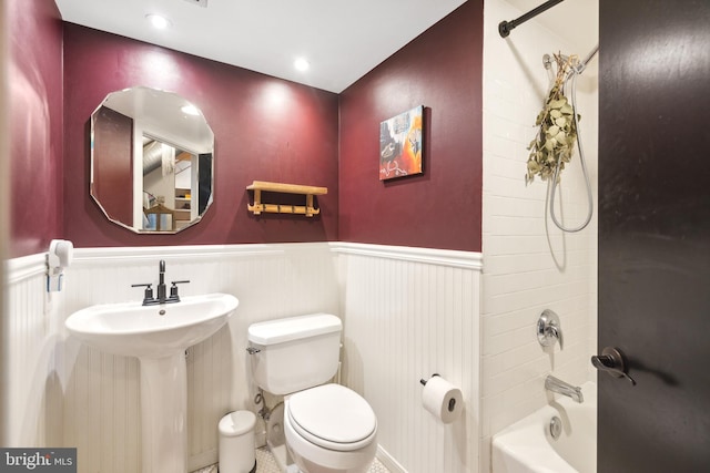 full bathroom featuring sink, bathing tub / shower combination, and toilet