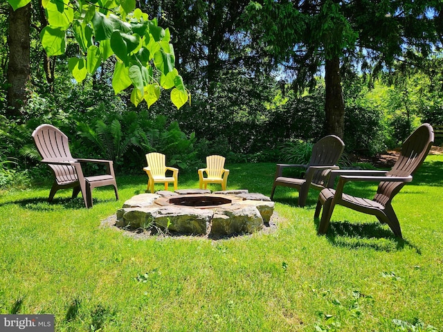 view of yard with an outdoor fire pit