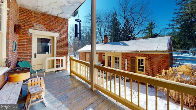 view of snow covered deck