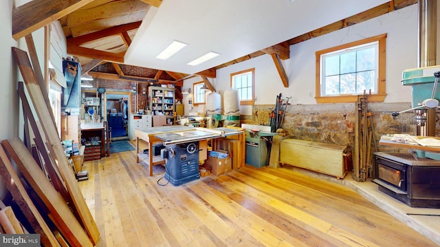 kitchen featuring beam ceiling and light wood-type flooring