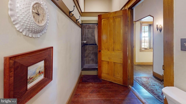 hallway featuring dark hardwood / wood-style floors