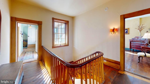 hall with dark hardwood / wood-style flooring