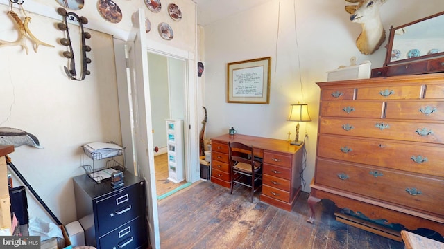 office space with dark wood-type flooring