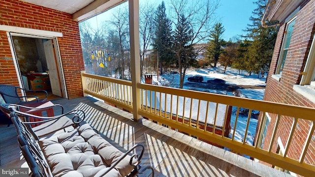 view of snow covered deck