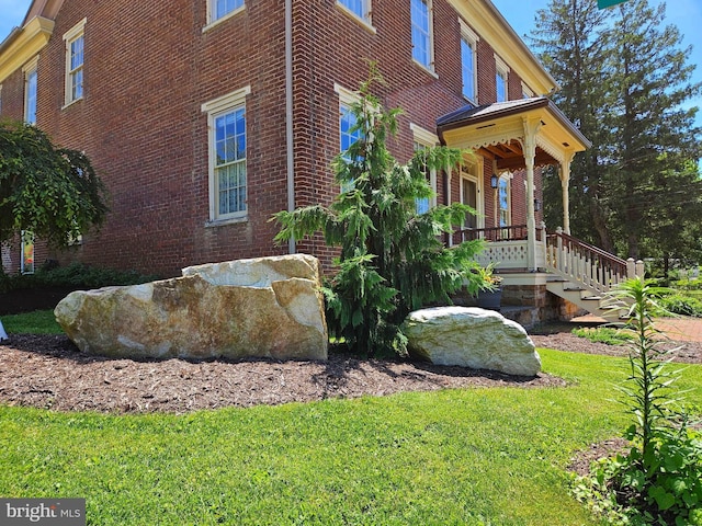 view of property exterior featuring a yard