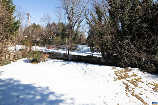 view of yard layered in snow