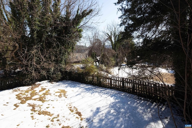 view of yard covered in snow