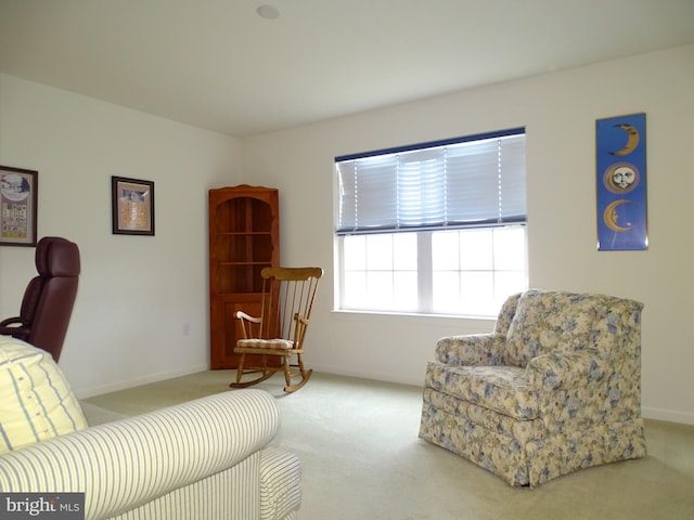 sitting room with light carpet and baseboards