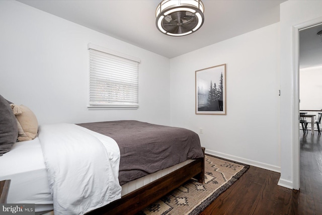 bedroom featuring dark wood-type flooring