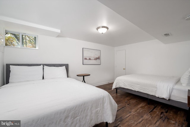 bedroom featuring dark hardwood / wood-style floors