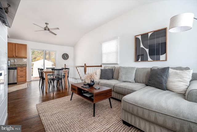 living room featuring lofted ceiling, dark hardwood / wood-style flooring, and ceiling fan