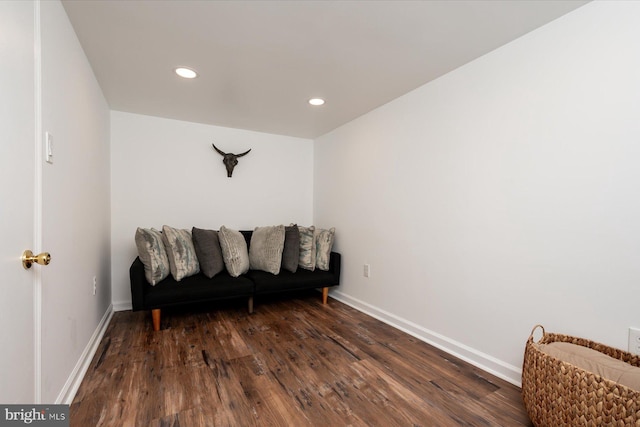 sitting room with dark hardwood / wood-style flooring