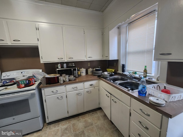 kitchen featuring white cabinetry, light tile patterned floors, sink, and white range with electric stovetop