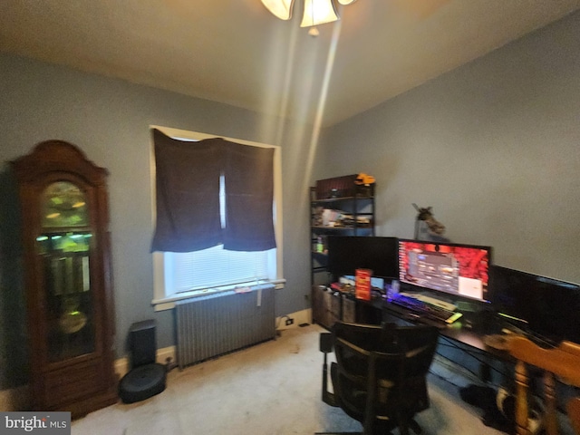 office featuring radiator heating unit and carpet