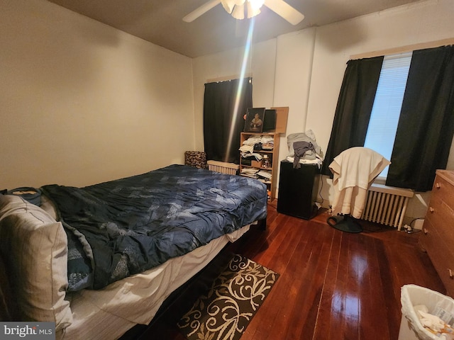 bedroom featuring dark wood-type flooring and ceiling fan