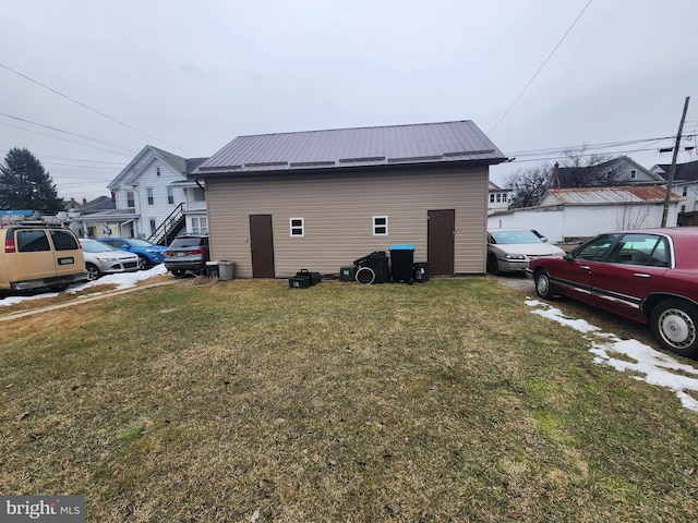 view of property exterior with a yard