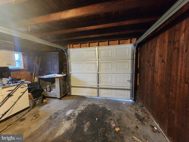 garage featuring wooden walls