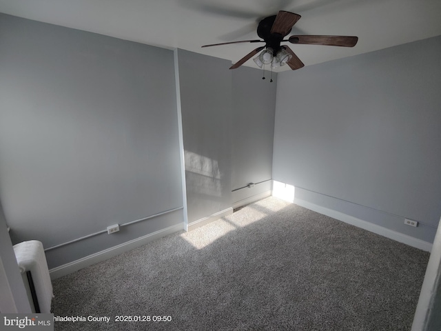 spare room featuring carpet flooring and ceiling fan