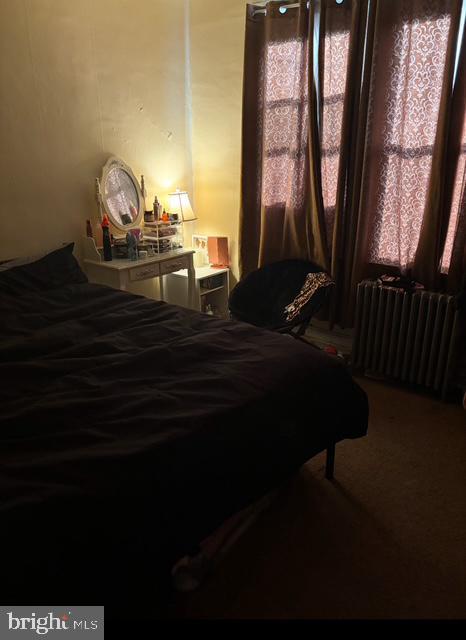 bedroom featuring radiator