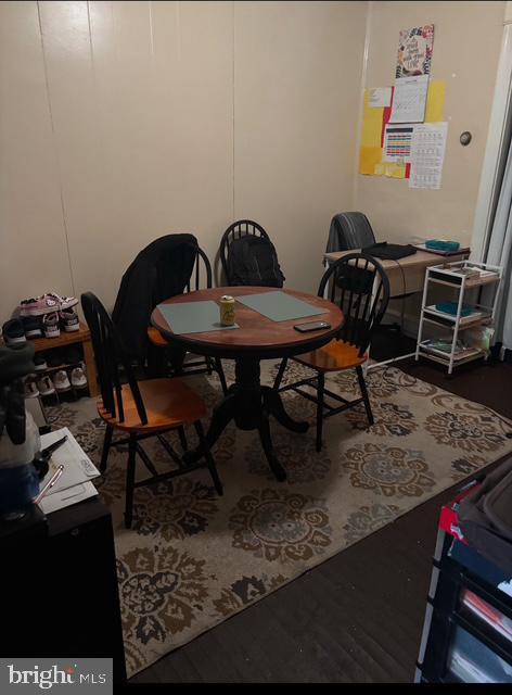 dining area with wood-type flooring