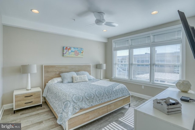 bedroom featuring light hardwood / wood-style floors and ceiling fan