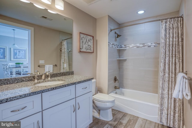 full bathroom with shower / bath combination with curtain, wood-type flooring, toilet, and vanity