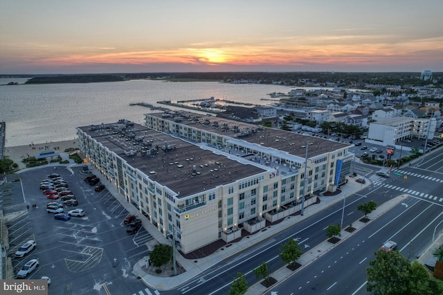 aerial view at dusk with a water view