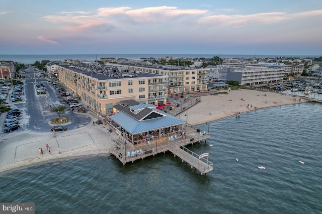 aerial view at dusk with a water view