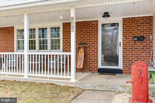 entrance to property with a porch