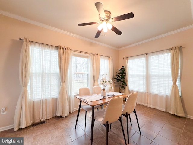 dining space featuring light tile patterned floors and ornamental molding