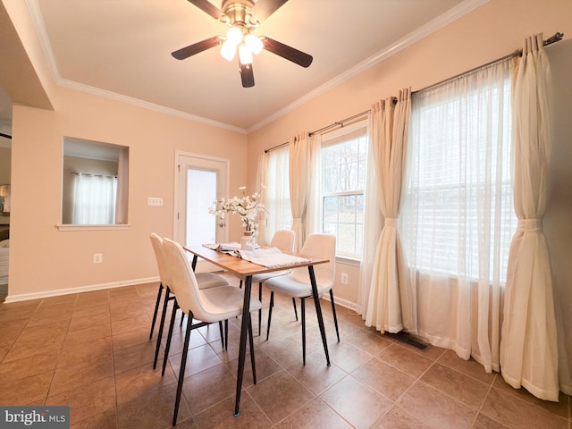 dining area with crown molding, tile patterned floors, and ceiling fan