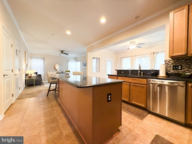 kitchen featuring sink, a center island, ornamental molding, dishwasher, and backsplash